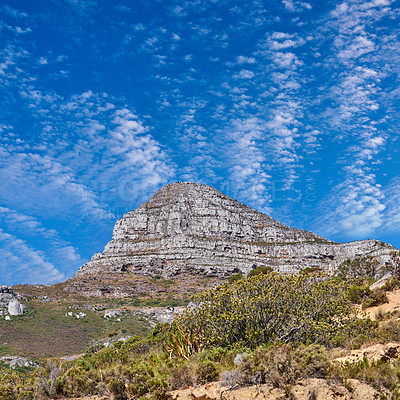 Buy stock photo Copyspace with scenery of Lions Head at Table Mountain National Park in Cape Town, South Africa against a cloudy blue sky background. Panoramic of an iconic landmark and famous travel destination