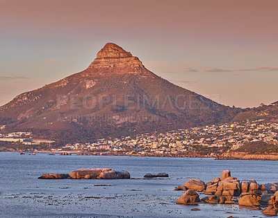 Buy stock photo Copy space with scenic landscape view of a coastal town along Lions Head mountain in Cape Town, South Africa against a twilight sky background. Panoramic of the sea with an iconic landmark at sunset