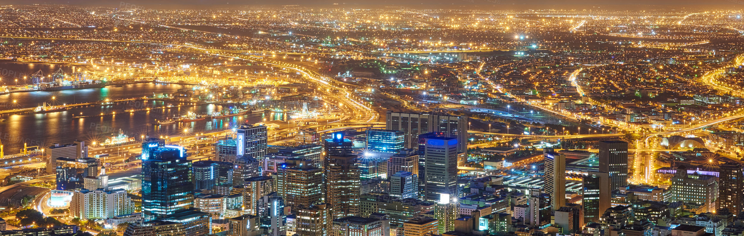 Buy stock photo Panorama night landscape of Cape Town city in South Africa. Electricity powered urban CBD, traffic, surrounding suburbs or neighbourhoods. Scenic view of lit town and travel and tourism destination