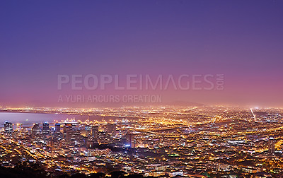 Buy stock photo Cape Town after sunset, a cityscape view from Signal Hill, South Africa. Bright lights over a city landscape on a beautiful summer evening. panoramic of the city. Illuminated buildings and streets