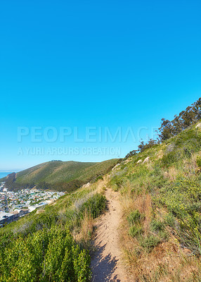 Buy stock photo Hill, trail landscape and blue sky in city for hiking pathway, travel destination and trekking route. Nature background, terrain and mockup with urban view for sightseeing, exploration and adventure