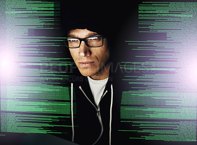 Buy stock photo Cropped shot of a young hacker cracking a computer code in the dark