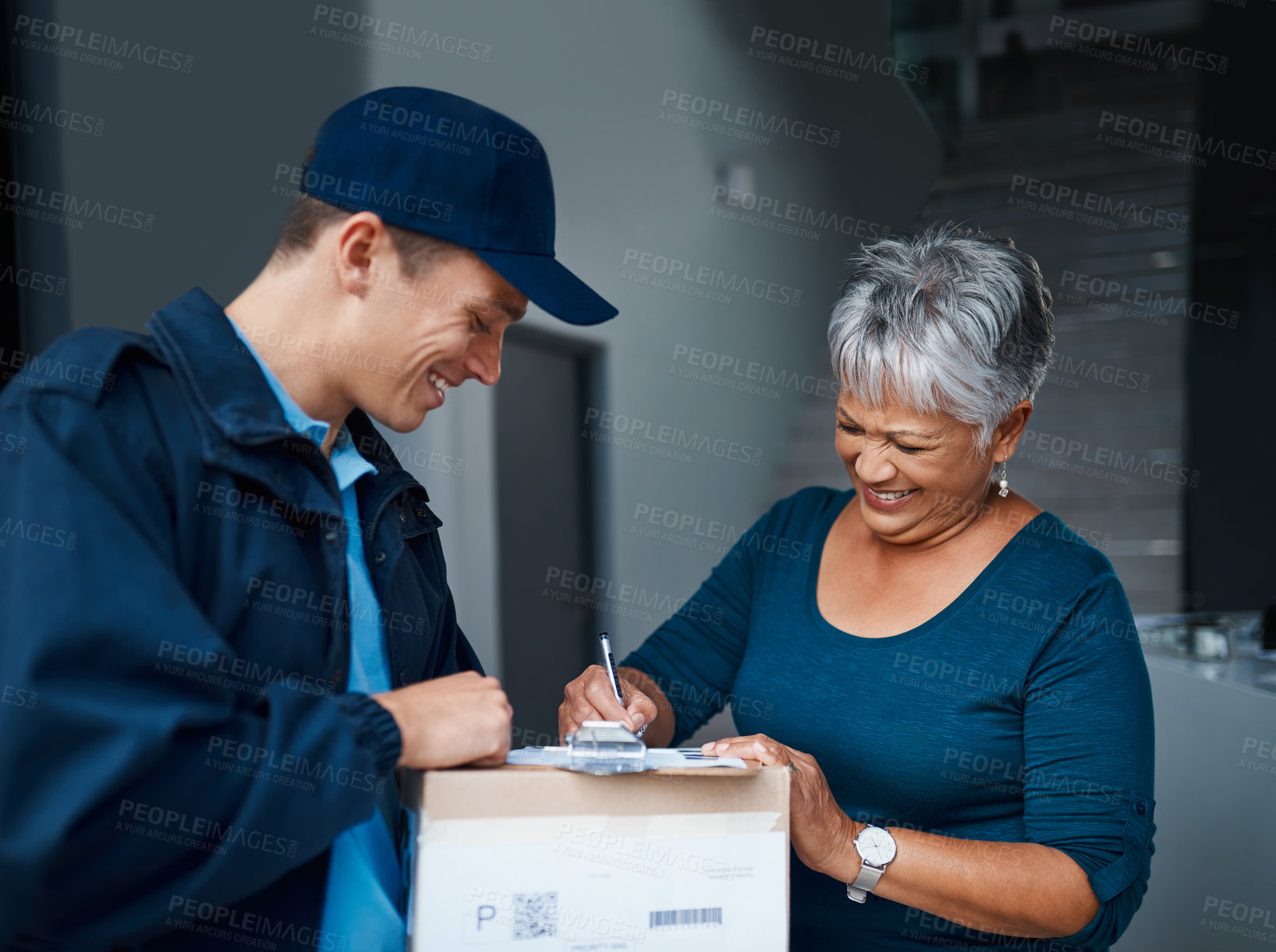 Buy stock photo Cropped shot of a handsome young man delivering a package to a customer