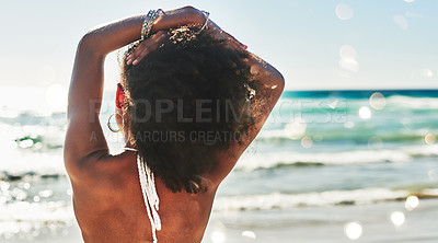 Buy stock photo Rearview shot of a beautiful young woman looking at the calming beach view