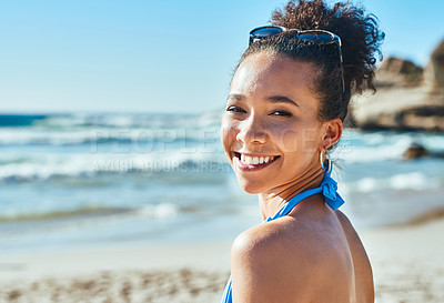 Buy stock photo Portrait of a beautiful young woman enjoying a summer’s day at the beach