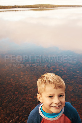 Buy stock photo Cropped shot of a little boy standing outside