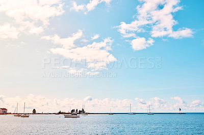 Buy stock photo Shot of boats on the ocean