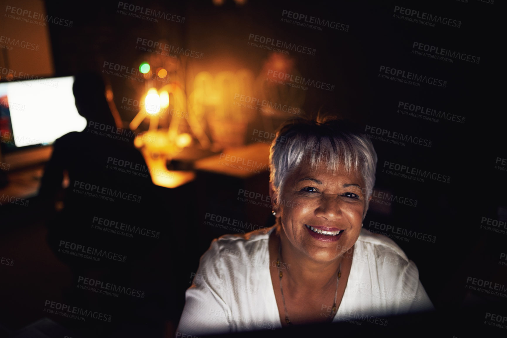 Buy stock photo Portrait of a mature businesswoman working late in an office