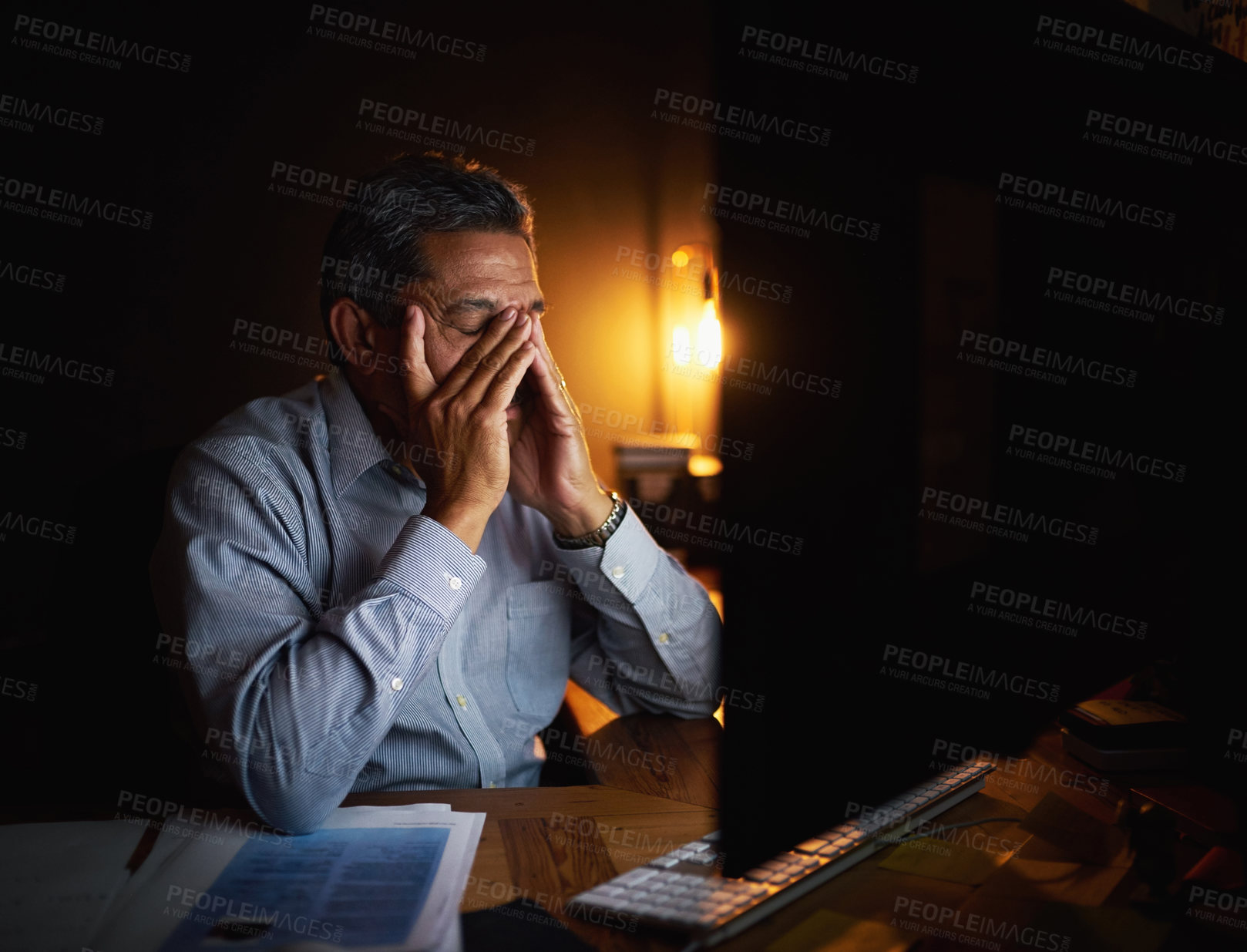 Buy stock photo Mature businessman, headache and night with anxiety on computer for deadline, overworked or burnout at office. Tired man or frustrated employee working late with migraine, strain or pressure at desk