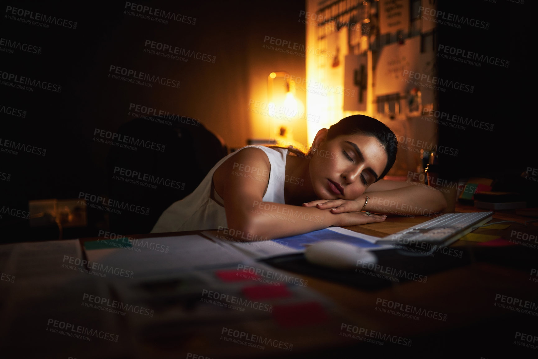 Buy stock photo Night, sleeping and tired business woman at office desk with burnout, exhausted or insomnia. Overwork, lazy or worker rest with fatigue, relax and dream of project deadline with low energy at startup