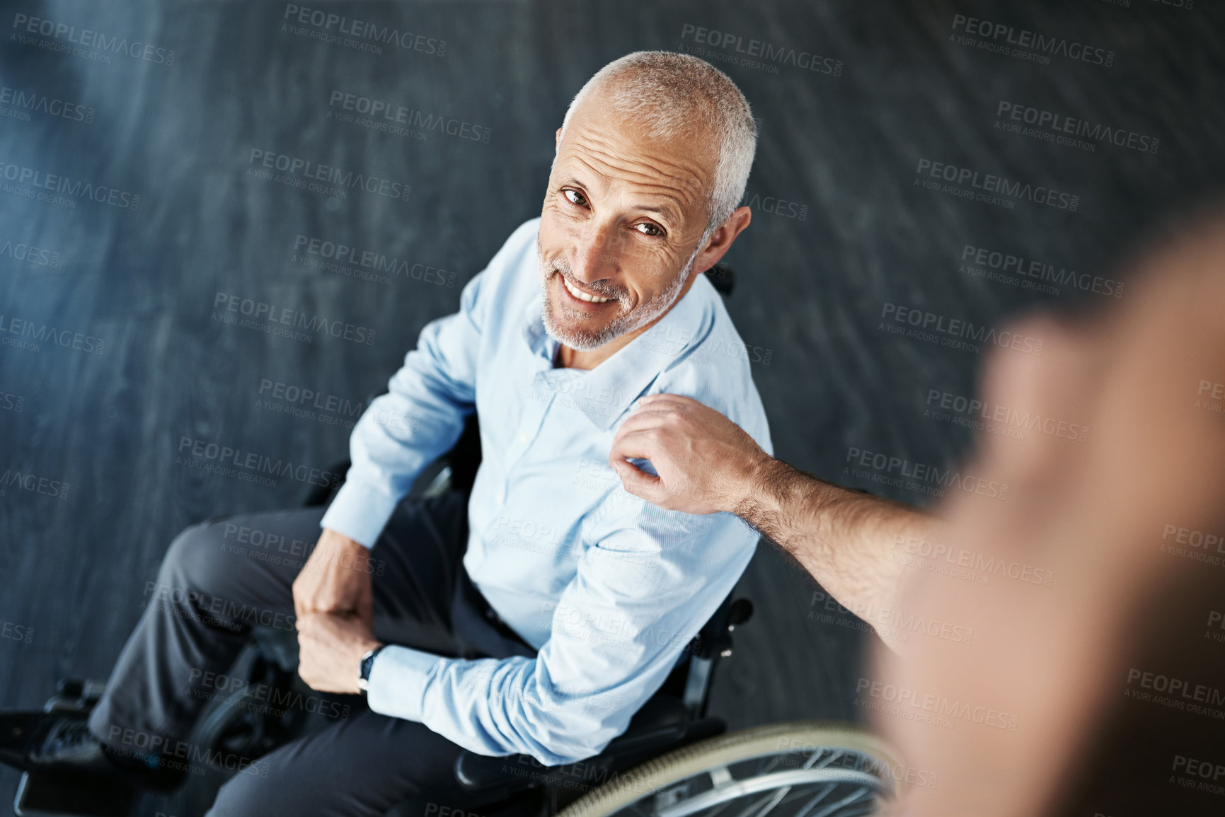 Buy stock photo High angle shot of a senior patient being cared for by a male nurse