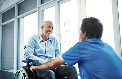 Buy stock photo Shot of a senior patient being cared for by a male nurse