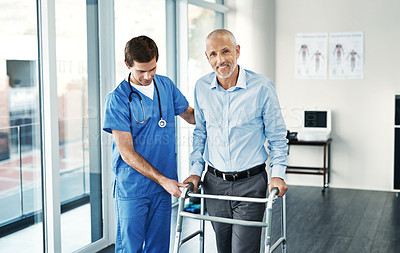 Buy stock photo Portrait of a senior patient with a walker getting assistance from a male nurse