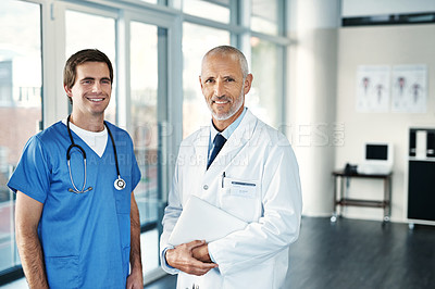 Buy stock photo Portrait of two medical practitioners standing together in a hospital