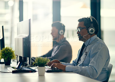 Buy stock photo Men, call center and together by computer with typing, reading and consulting with client. Agent, headphones and mic in team for tech support, telemarketing or customer care with advice in workplace