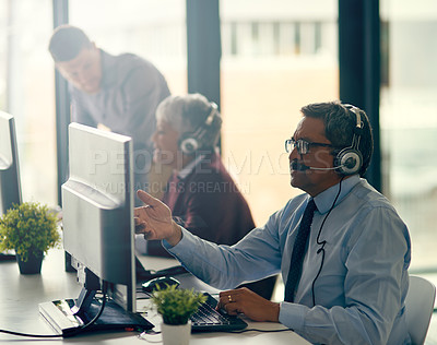 Buy stock photo Mature man, call center and office in computer with typing, reading and consulting on web. Agent, headphones and mic in team for tech support, telemarketing or customer care with advice in workplace