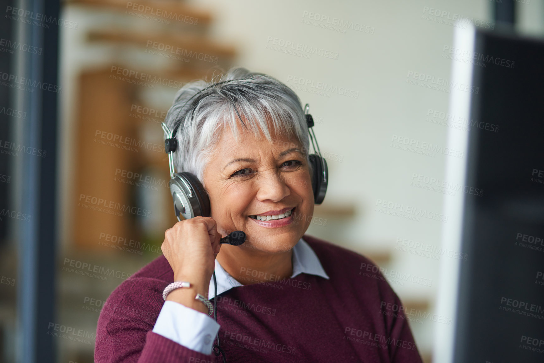 Buy stock photo Portrait of a mature woman working on a computer in a call centre