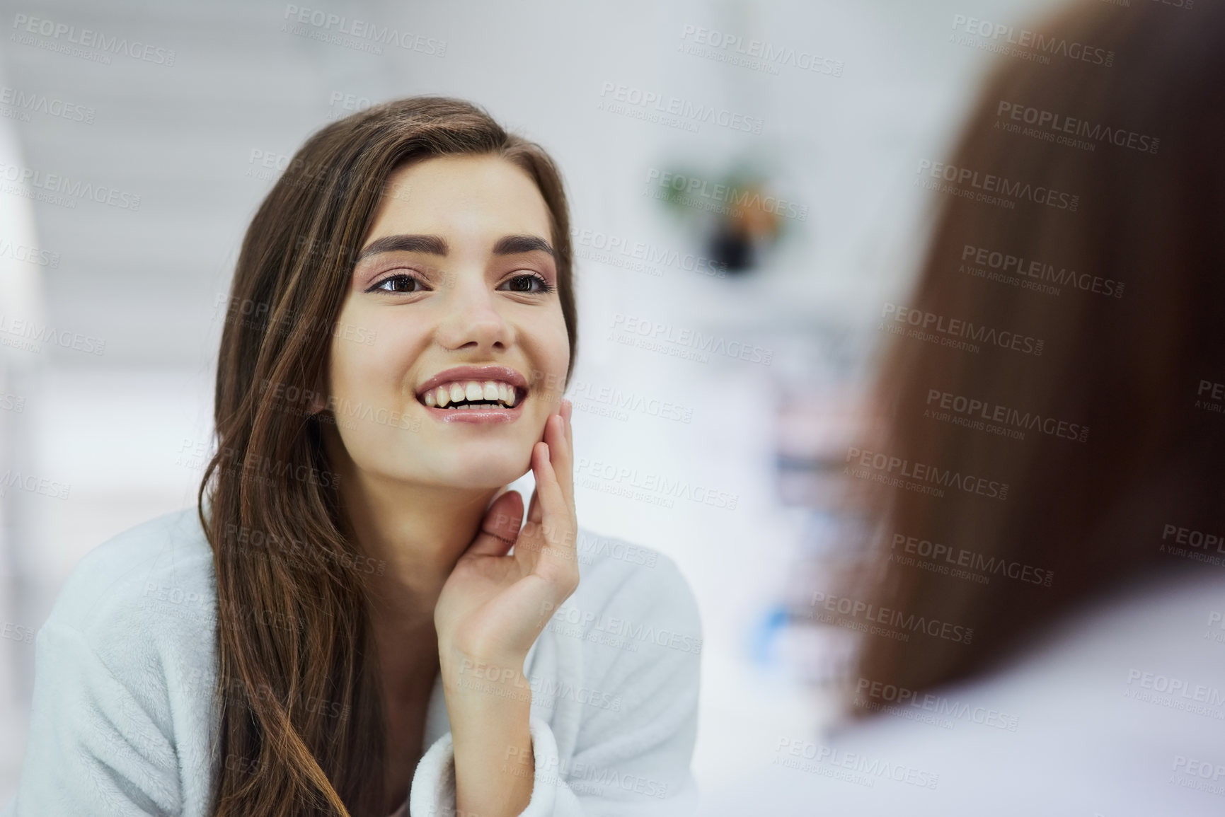 Buy stock photo Skincare, mirror and smile with woman in bathroom for shine, collagen and spa treatment. Beauty, cosmetics and reflection with female person at home for face glow, dermatology and sunscreen
