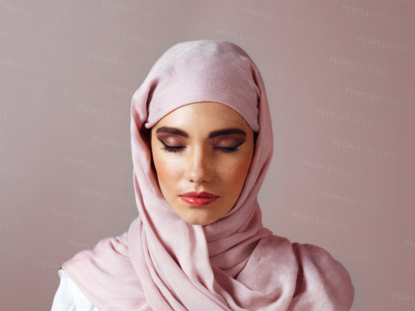 Buy stock photo Muslim, makeup and beauty with woman in studio for islamic fashion, arabic culture and modest clothes. Raya, eid Mubarak celebration and hijab scarf with  person on background for oriental design
