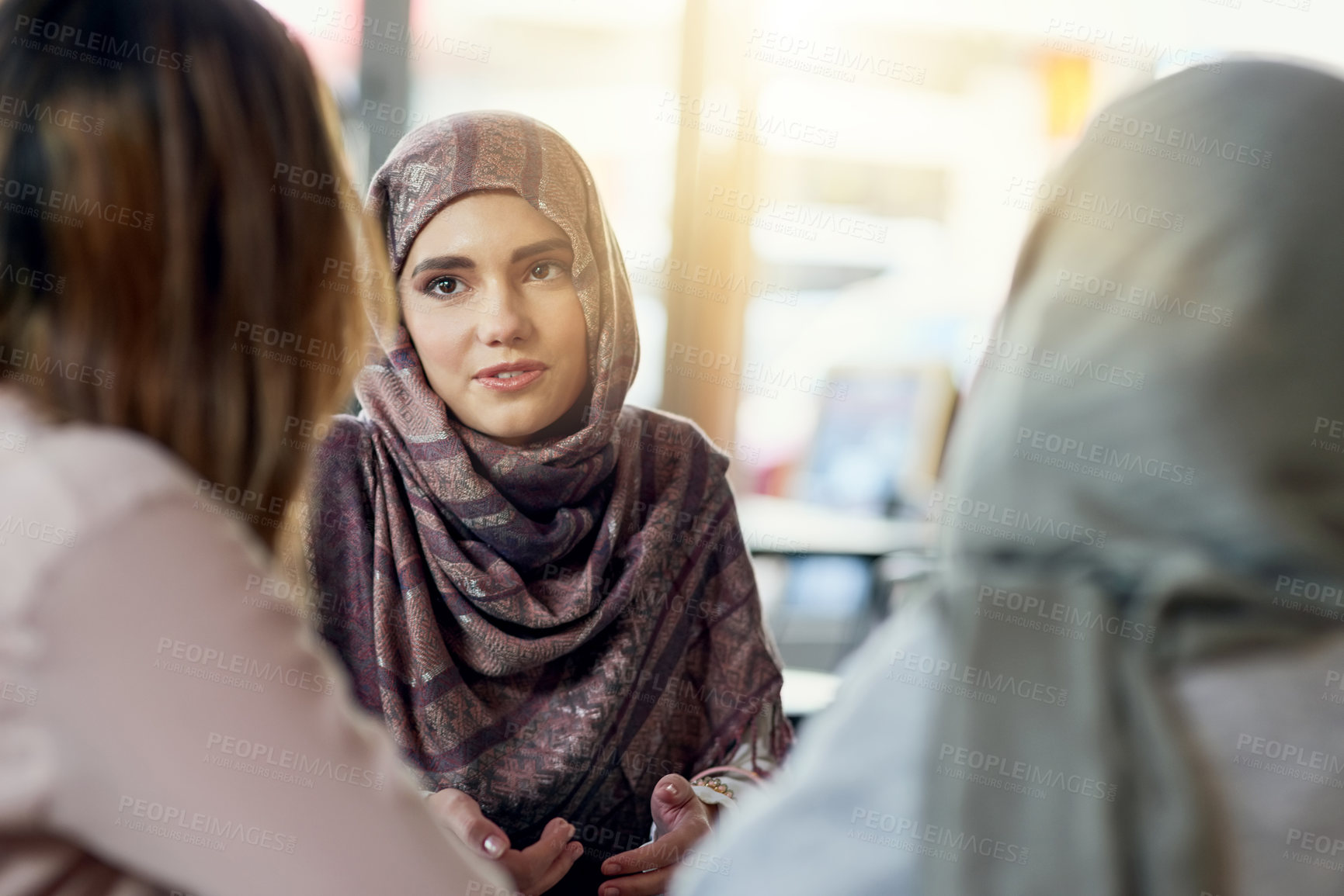 Buy stock photo Conversation, friends and Muslim women in cafe, bonding and speaking together. Coffee shop, relax and Islamic girls, group or people talking, chat and discussion for social gathering in restaurant