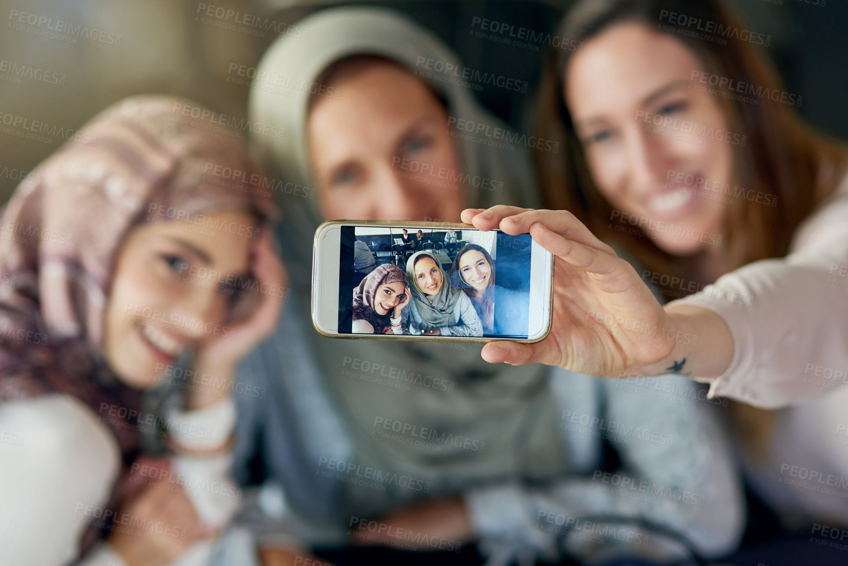 Buy stock photo Muslim women, friends and selfie with phone, smile and happiness for post on blog, app or social network. Happy islamic woman, group and smartphone for photography, profile picture and memory on web