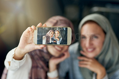 Buy stock photo Islamic woman, friends and selfie with phone, smile and happiness for post on blog, web or social media. Happy muslim women, screen and smartphone for photography, profile picture and memory on app