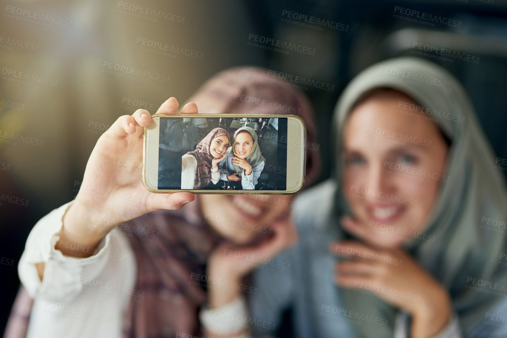 Buy stock photo Islamic woman, friends and selfie with phone, smile and happiness for post on blog, web or social media. Happy muslim women, screen and smartphone for photography, profile picture and memory on app
