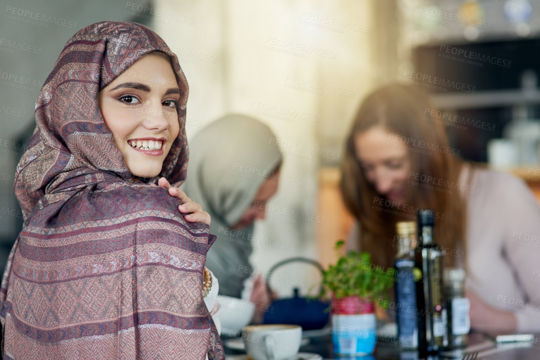 Buy stock photo Portrait of a happy young woman spending time with her friends in a cafe