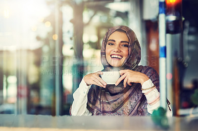 Buy stock photo Portrait of a young woman having a cup of coffee in a cafe