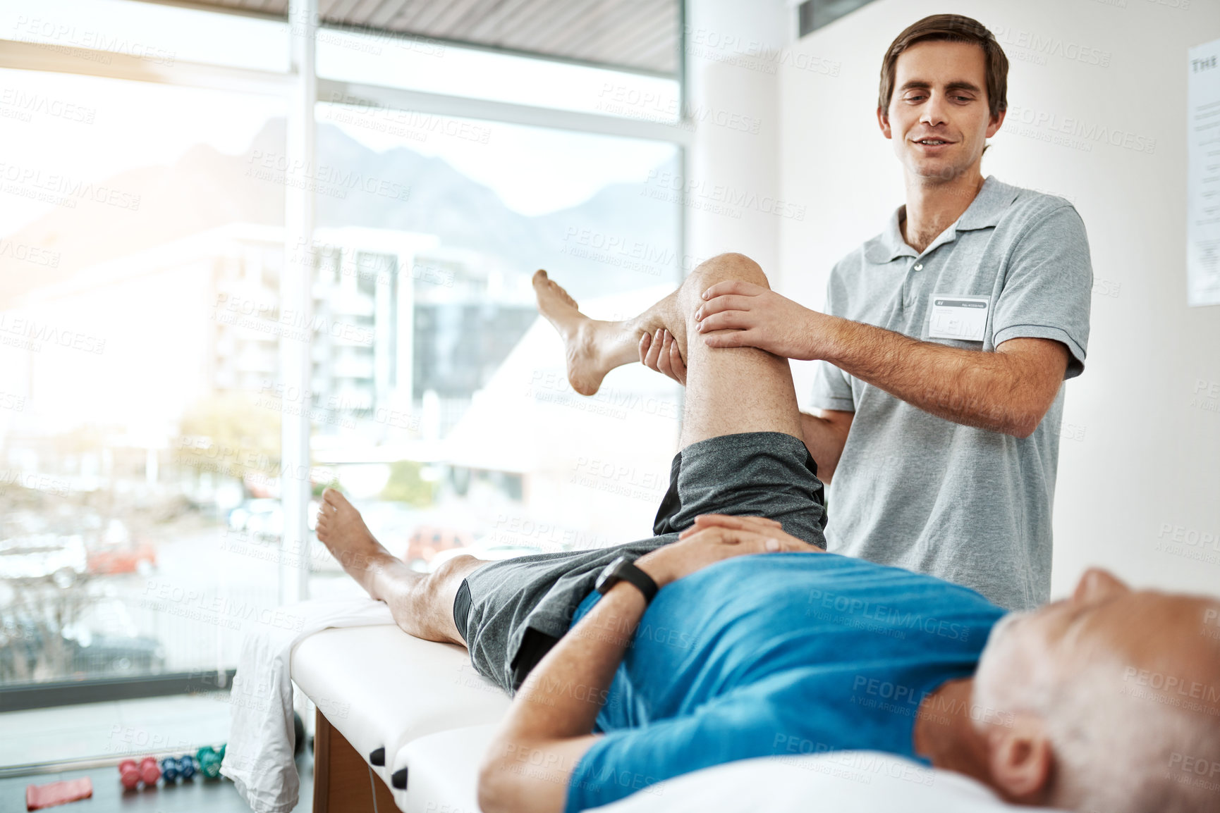 Buy stock photo Senior man, leg pain or physiotherapist working in consulting room, rehabilitation with exercise. Male people, office or together for physiotherapy service with health insurance or orthopedic support