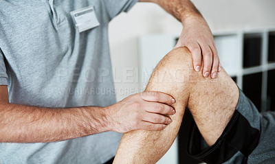 Buy stock photo Shot of an unrecognizable male physiotherapist helping a client with leg exercises who's lying on a bed