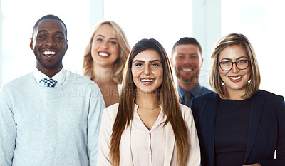 Buy stock photo Portrait of a group of confident work colleagues standing together against a white background