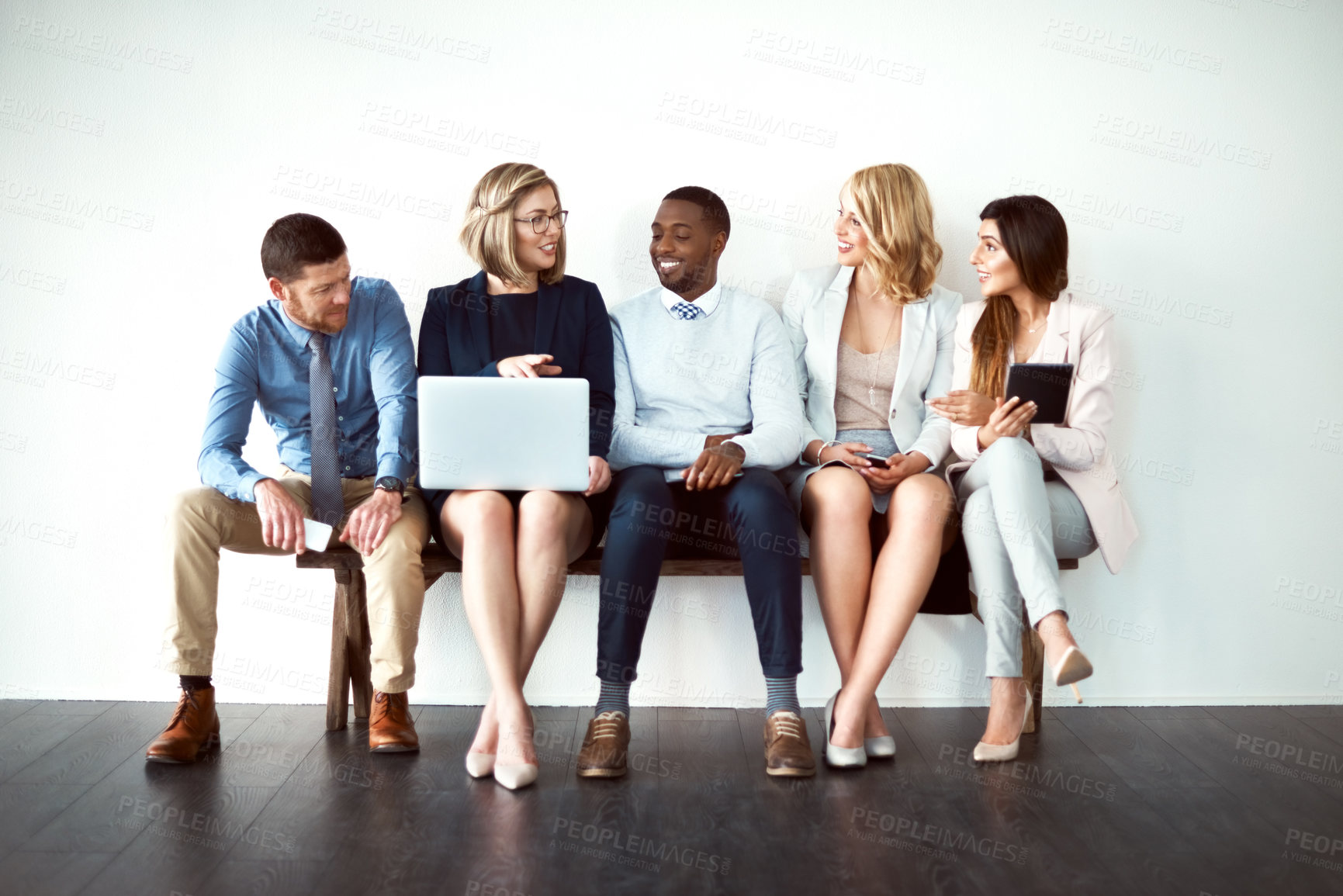 Buy stock photo Business people, row and waiting room with laptop for job search or career opportunity on a white studio background. Young, group or employees with technology in line for work offer or interview