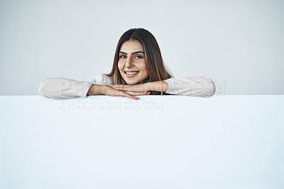 Buy stock photo Poster, portrait and smile of woman in studio on white background for advertising or marketing. Banner, billboard or signage and brand ambassador with  mockup space for information or promotion