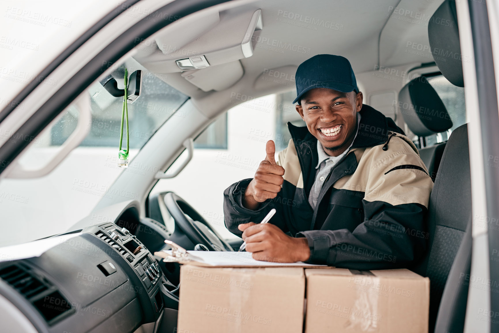 Buy stock photo Portrait of a courier showing thumbs up while sitting in a delivery van