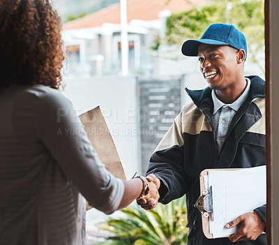 Buy stock photo Shot of a courier shaking hands with a customer while making a delivery