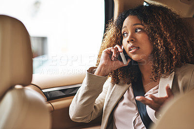 Buy stock photo Shot of an attractive businesswoman on a call while on her morning commute