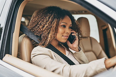 Buy stock photo Shot of an attractive businesswoman on a call during her morning commute