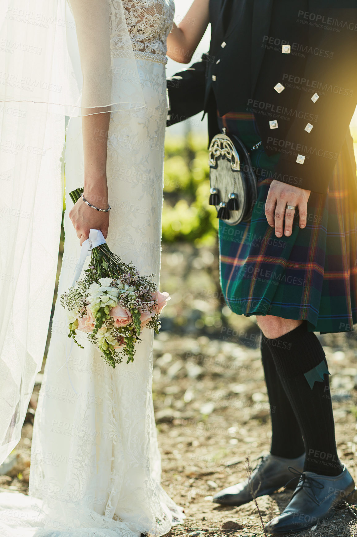 Buy stock photo Love, hug and couple with flowers for wedding day, relationship and bonding together with trust. Married people, bride and groom in closeup for marriage, soulmate and outdoor for Scottish ceremony