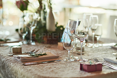 Buy stock photo Shot of a nicely set table with cutlery and crockery placed together inside of a building during the day