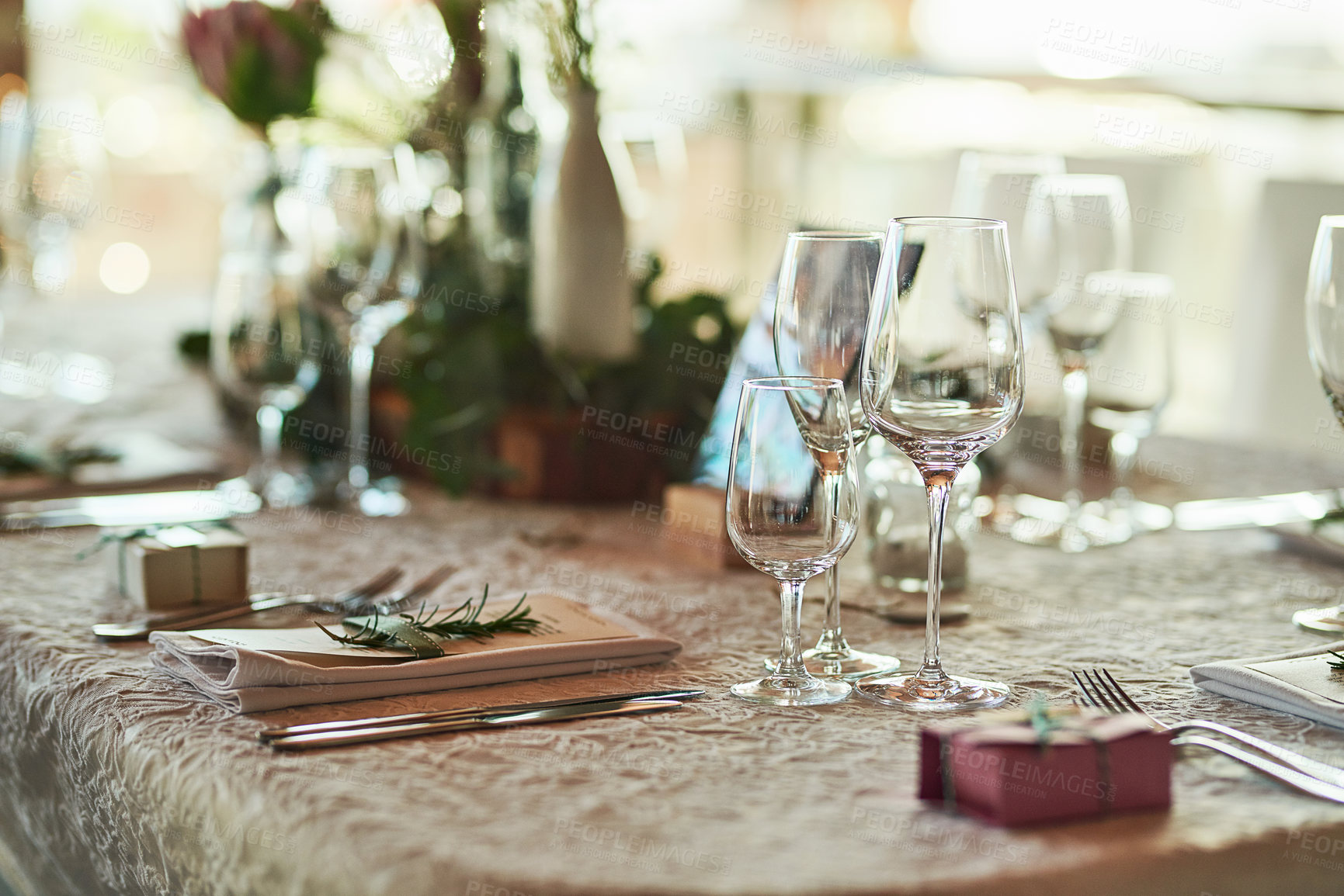 Buy stock photo Shot of a nicely set table with cutlery and crockery placed together inside of a building during the day