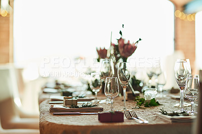 Buy stock photo Shot of a nicely set table with cutlery and crockery placed together inside of a building during the day