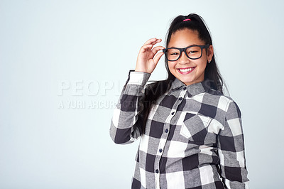 Buy stock photo Studio, eye care and portrait of kid with glasses for optometry, wellness and healthy eyesight. Girl, mockup and prescription spectacles of child with pride, smile and confidence on white background