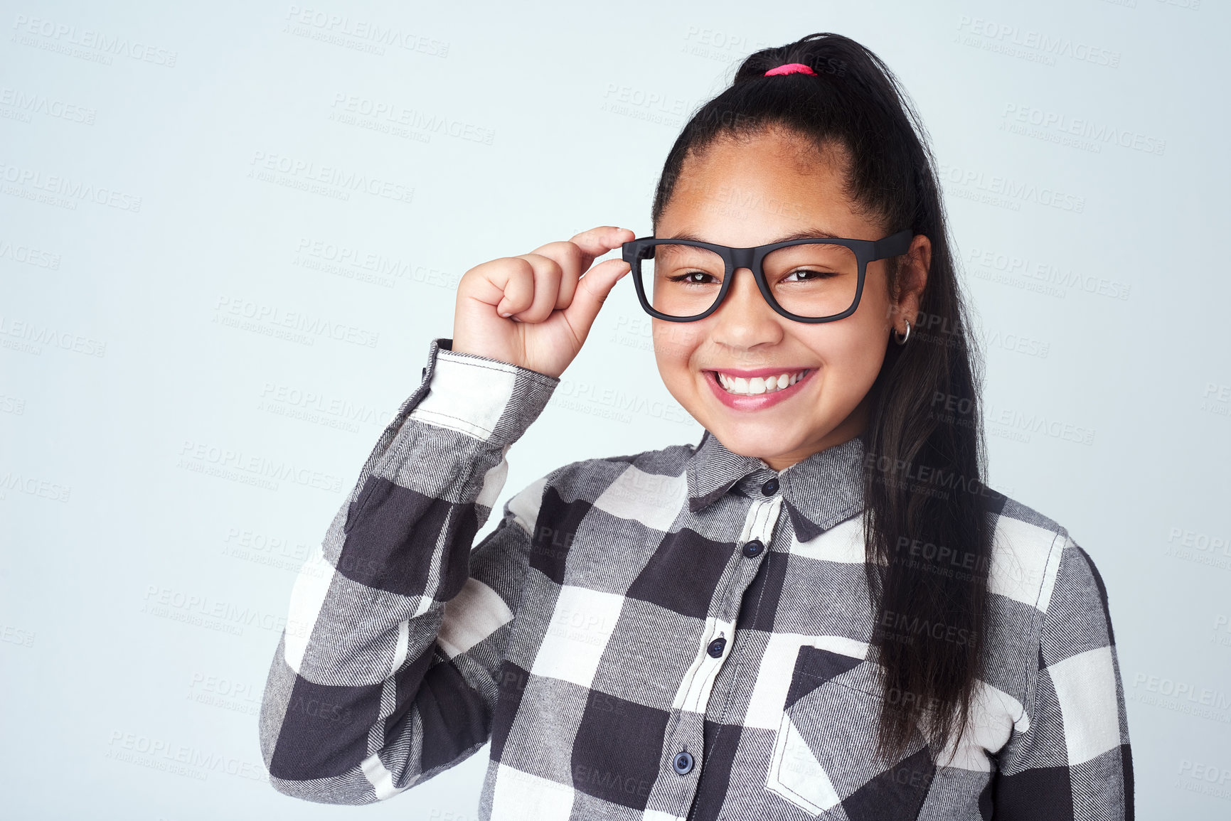 Buy stock photo Studio, glasses and portrait of girl with confidence for nerd style, trendy clothes and healthy eyesight. Kid, child and happiness with smile for quirky outfit, fashion and pride on white background