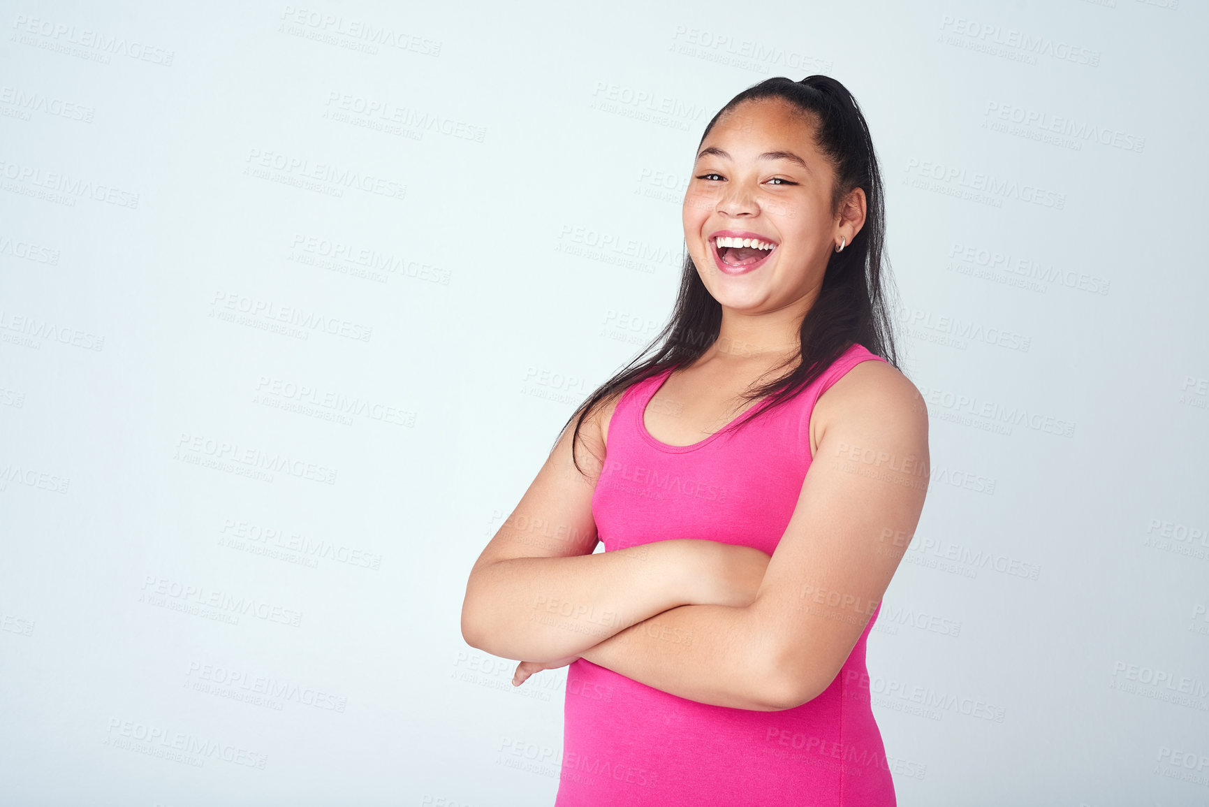 Buy stock photo Mockup, teen girl and arms crossed in portrait for fashion, trendy style and confident in studio. Young person, model child and happiness with pride for casual outfit, top or pose in white background