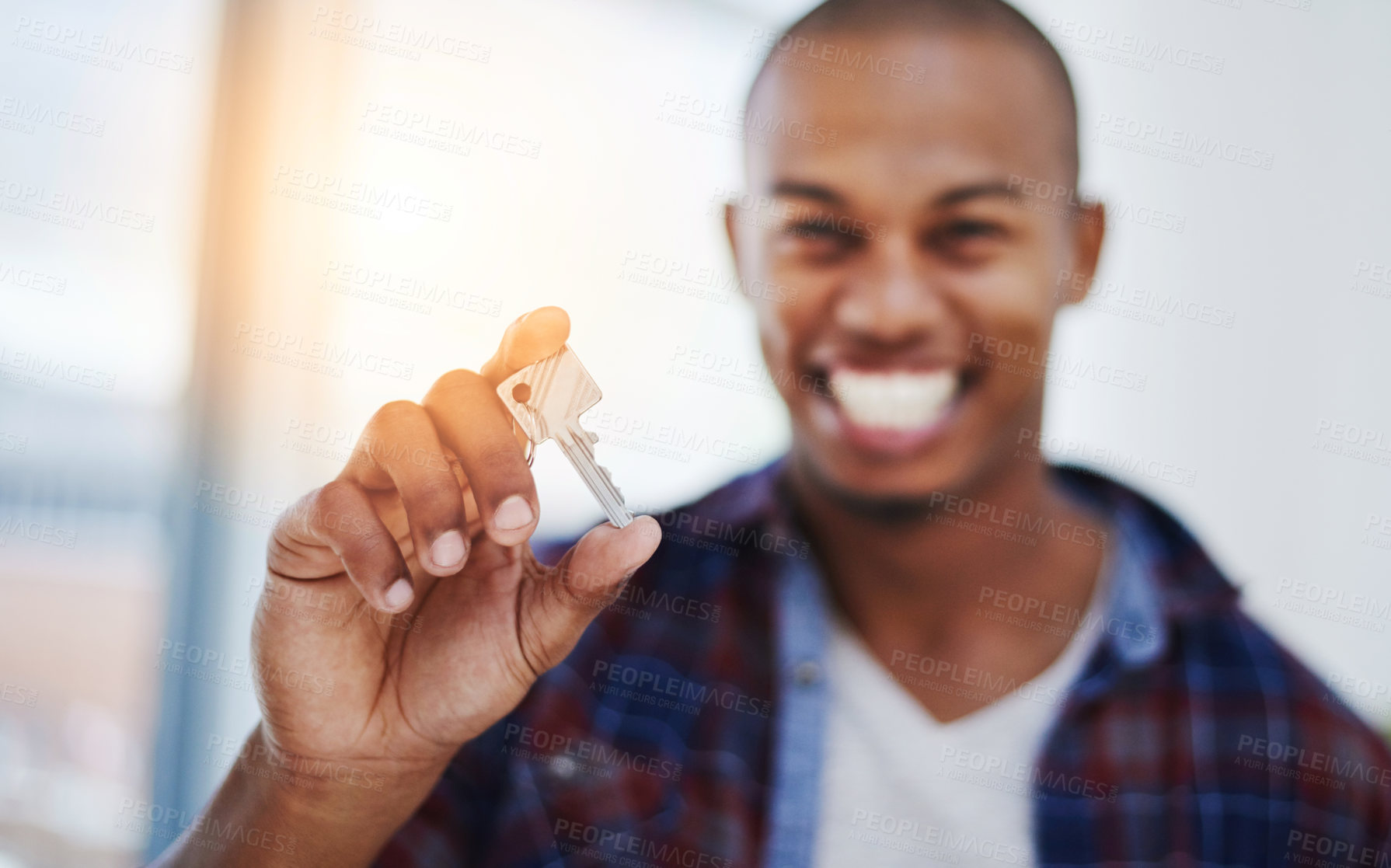 Buy stock photo Cropped shot of a handsome young man holding house keys in his new home