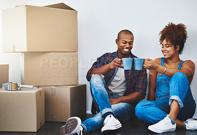 Buy stock photo Couple, boxes and coffee in apartment with cheers or smile for moving, investment and rental property. People, toast and happy in living room with package for logistics, new house and real estate