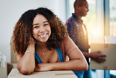 Buy stock photo Shot of an attractive young couple moving house