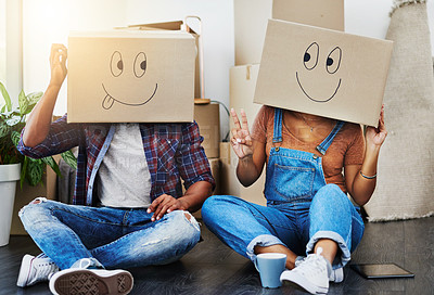 Buy stock photo Shot of an unrecognizable couple moving house