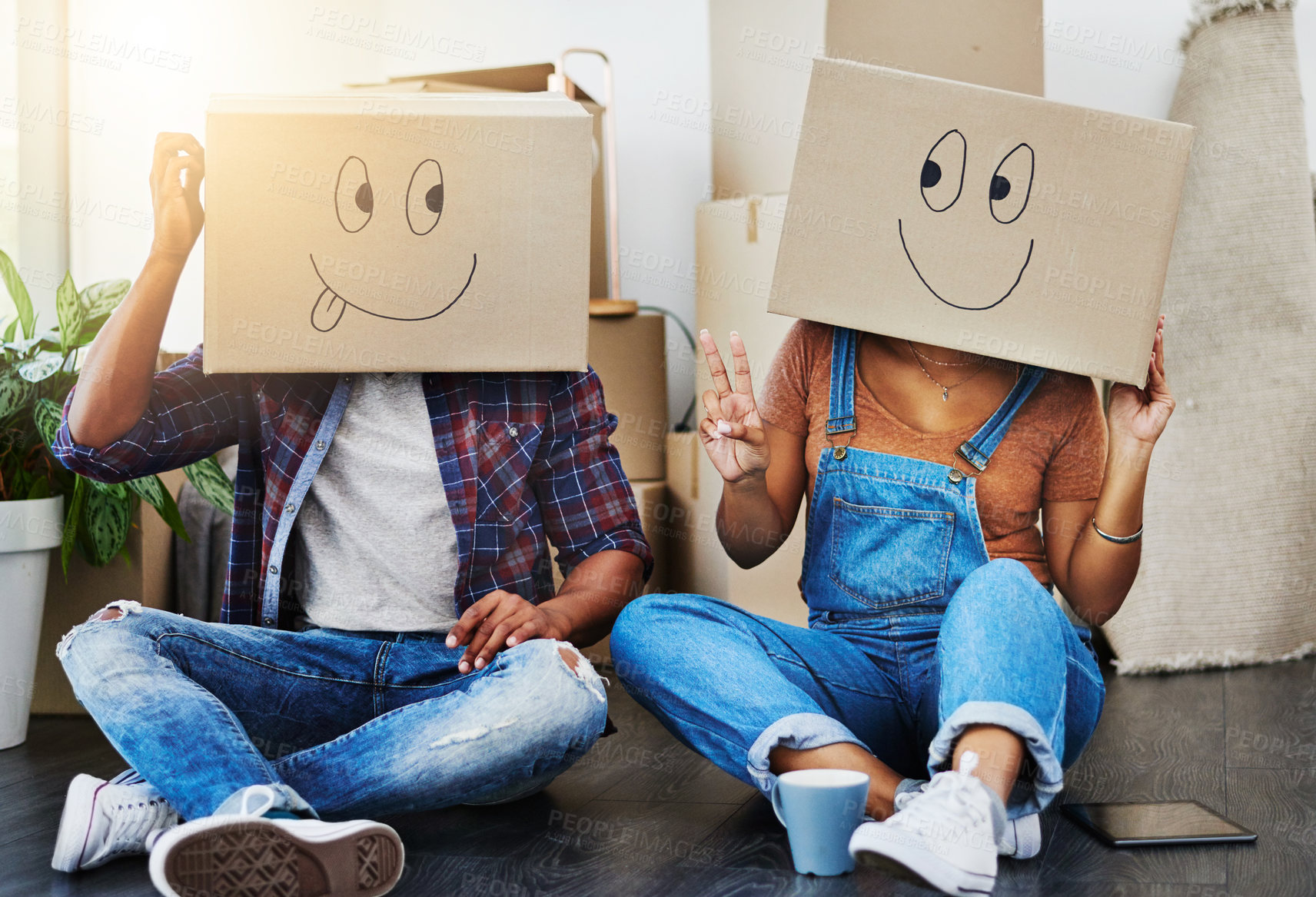 Buy stock photo Shot of an unrecognizable couple moving house